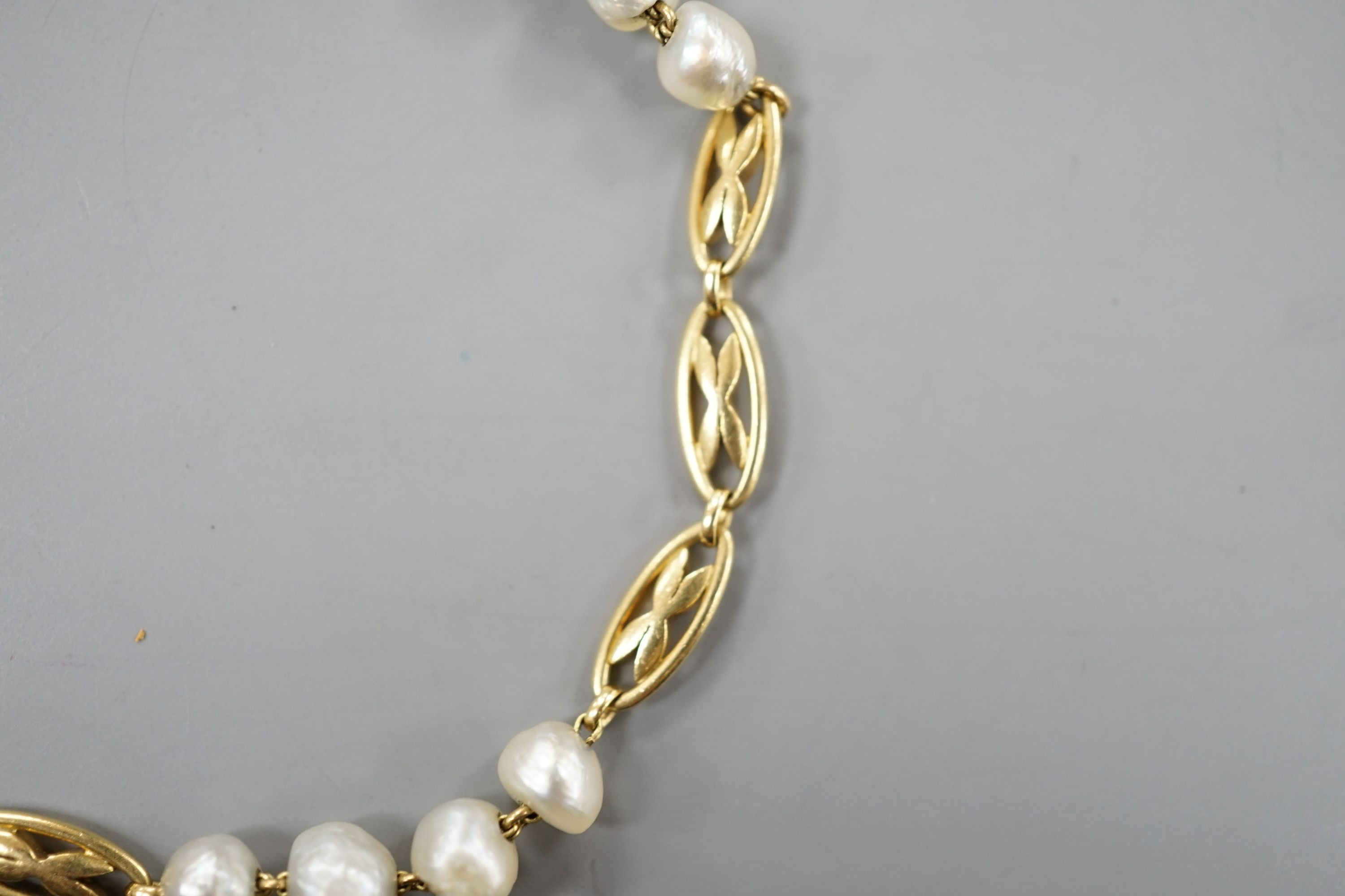 A yellow metal and baroque pearl set fancy link bracelet, 18cm